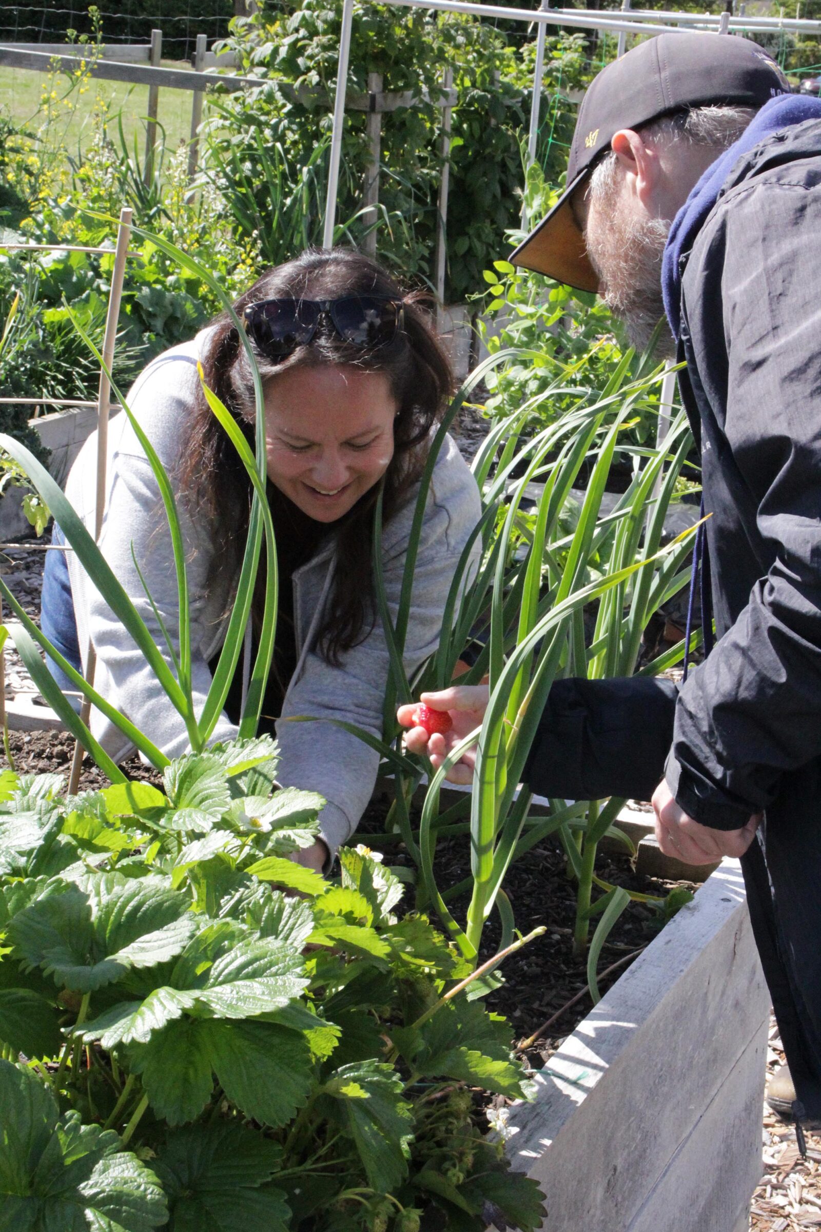 Laureen And Chris Tending The Garden