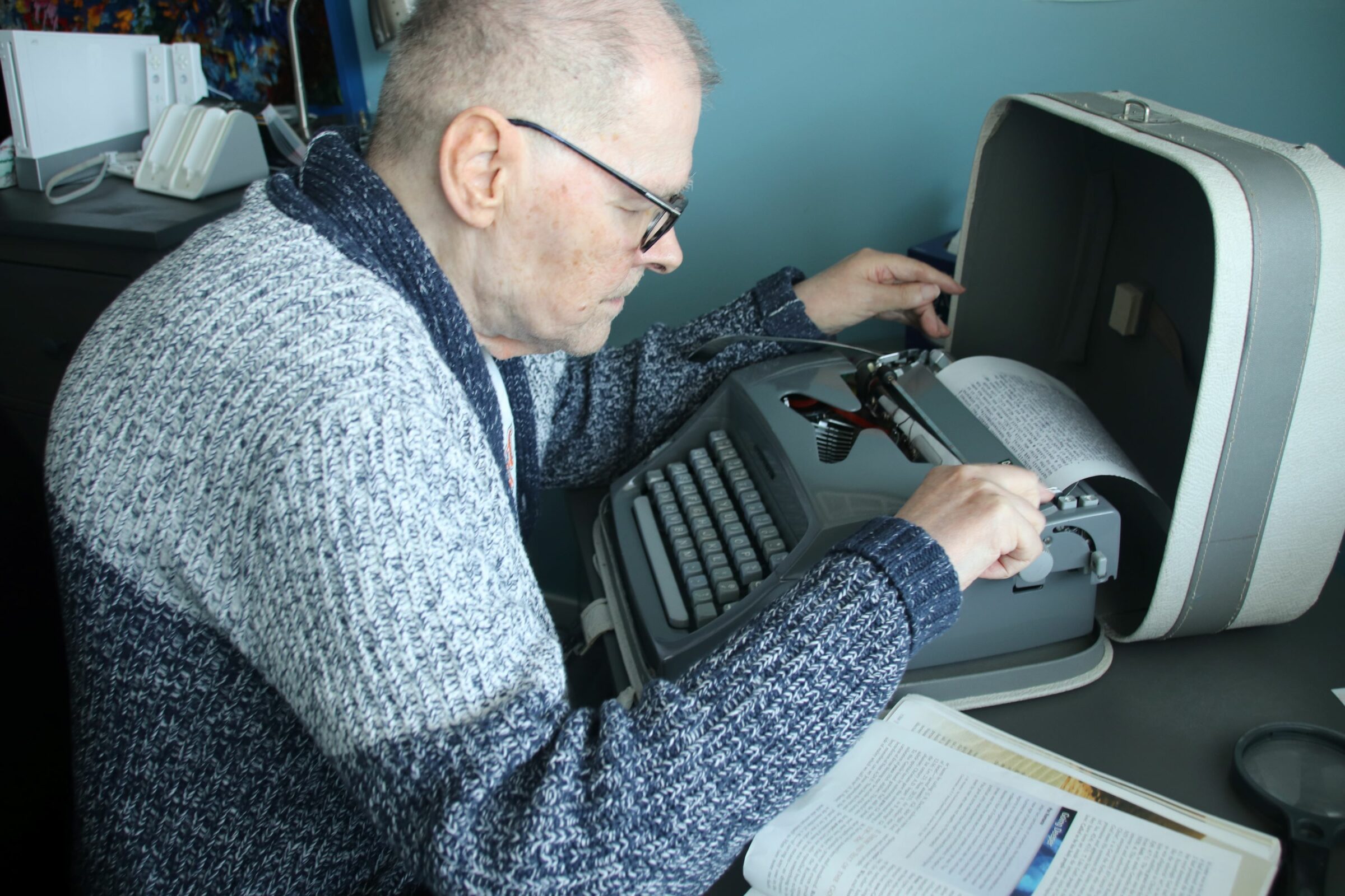 Nick Adjusting The Aper On His Typewriter