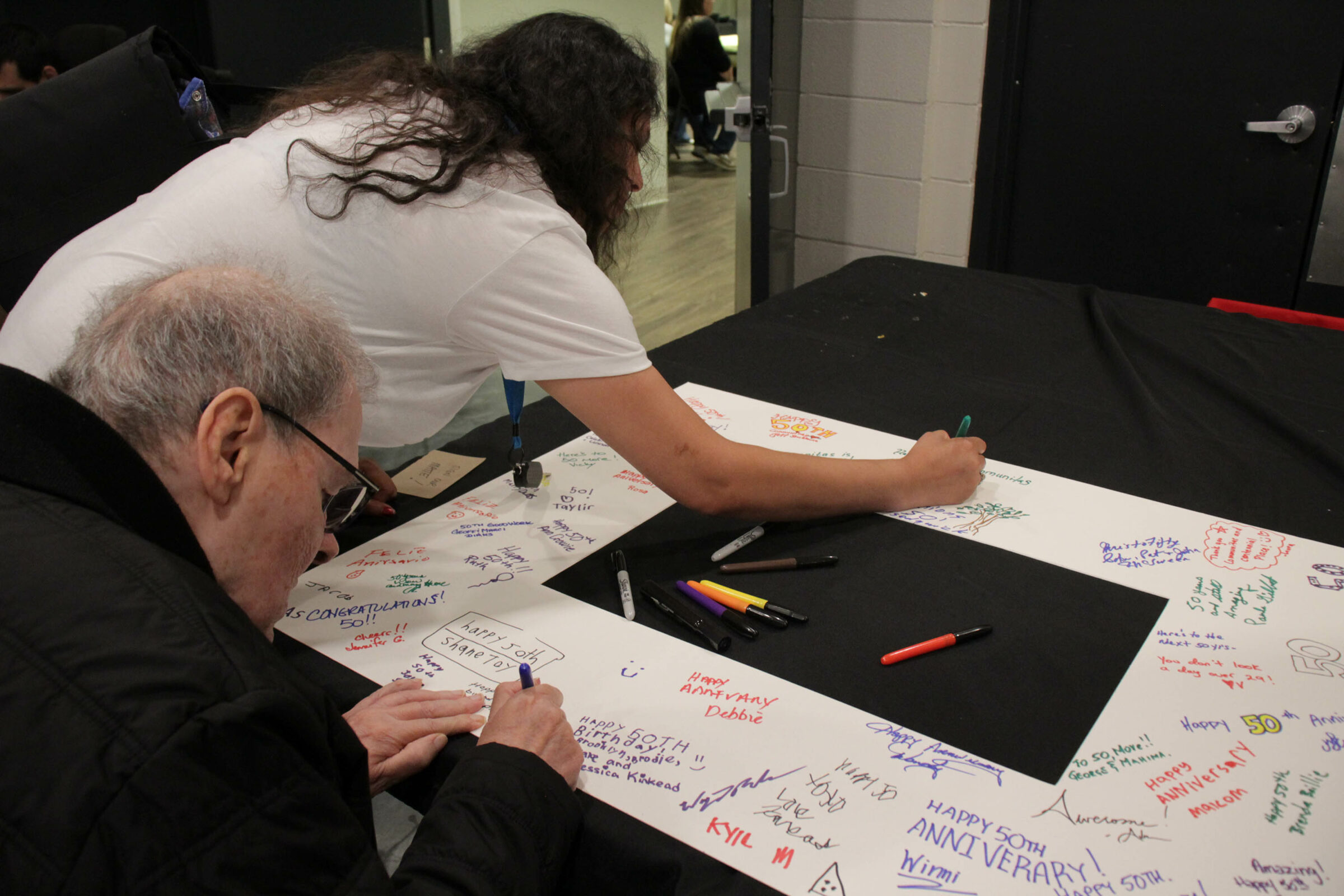 Nick And Support Worker Sign The Matte